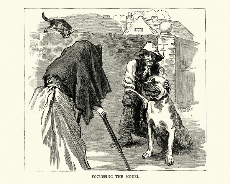 Victorian female photographer taking photograph of man and dog