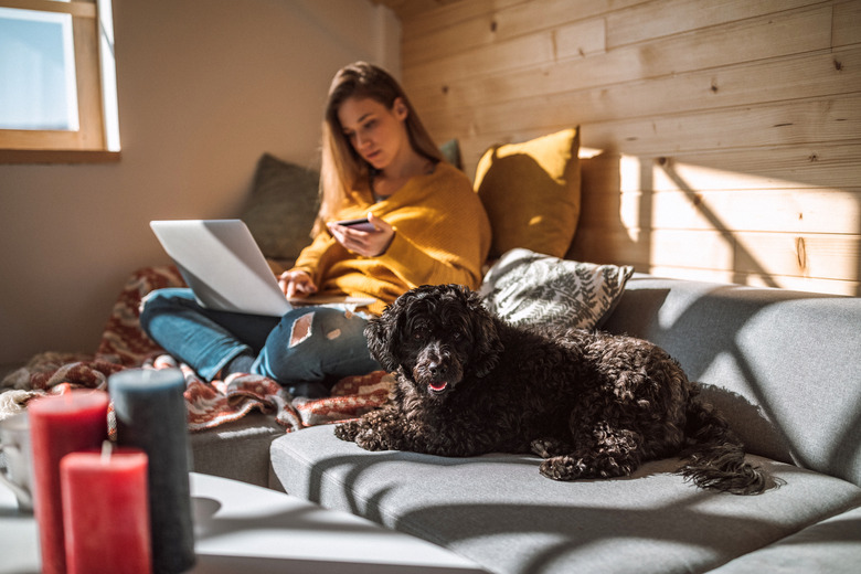 Relaxed Woman Purchasing Online from Living Room