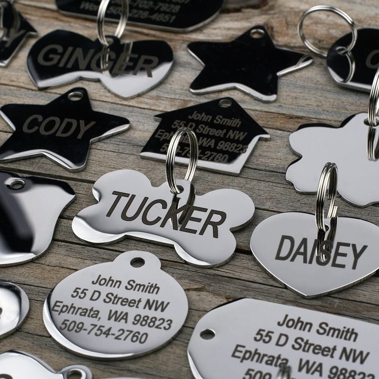 An array of stainless steel dog ID tags in different shapes like bones