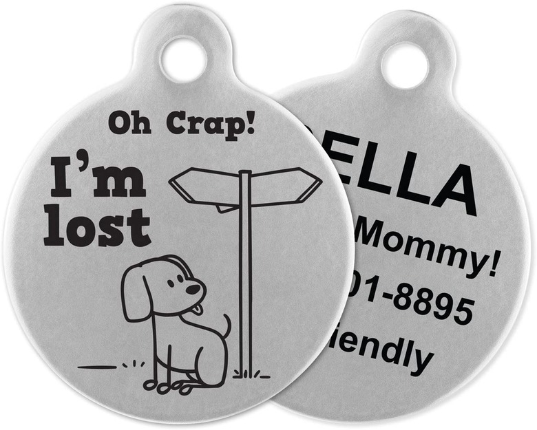 Circular stainless steel ID tags that says Oh Crap! I'm Lost with the image of a cartoon dog and street signs. The other side says Call My Mommy! and has contact information on it.