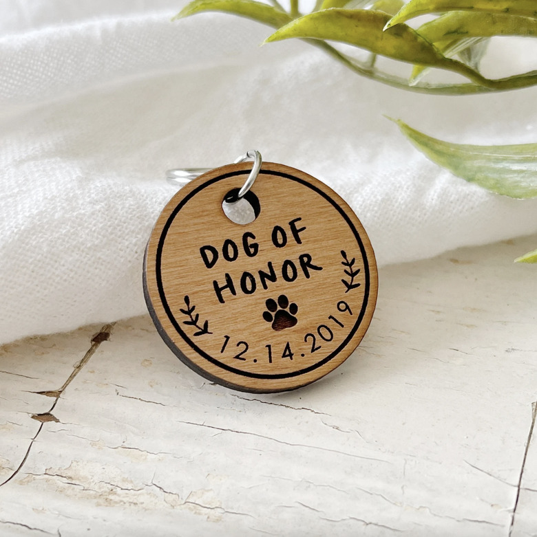Wood dog tag that reads 'Dog of Honor' and has the date December 14