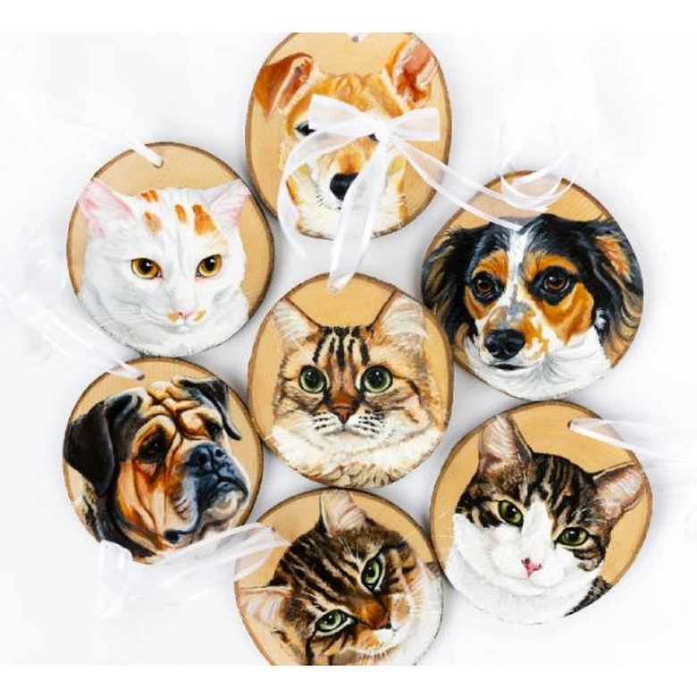 Wood ornaments with dogs and cat portraits on them