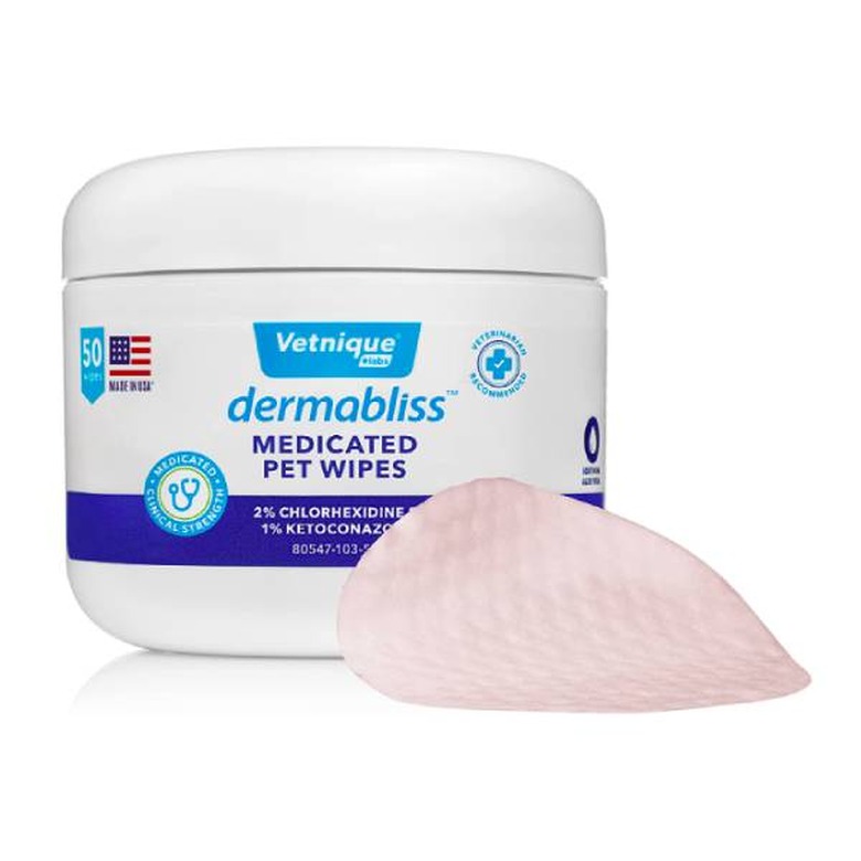 Vetnique Labs Dermabliss Anti-Itch and Medicated Wipes against a white background. Also in the photo is an example of what the wipes look like. They resemble round