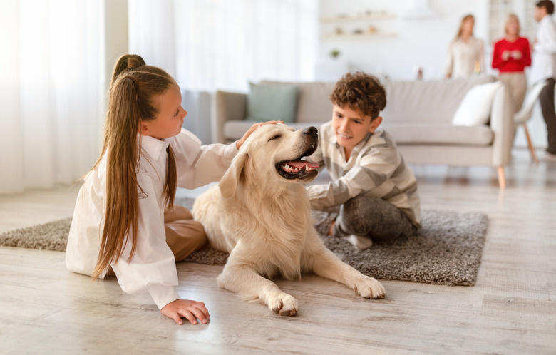 Two cute kids sitting on floor at home