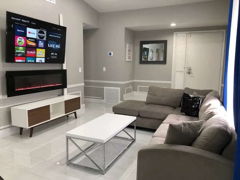 Remodeled living room with wall-mounted smart TV in Orlando