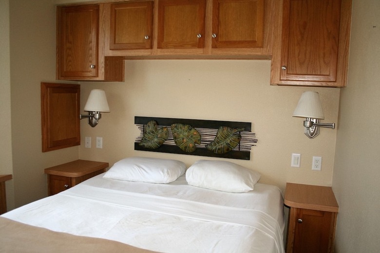 Clean white bedspread in bedroom in cottage rental.