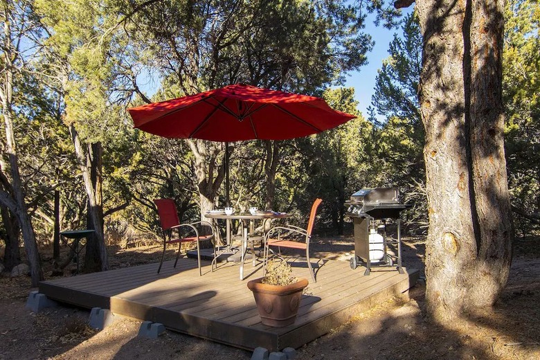 Backyard platform wood deck with a table