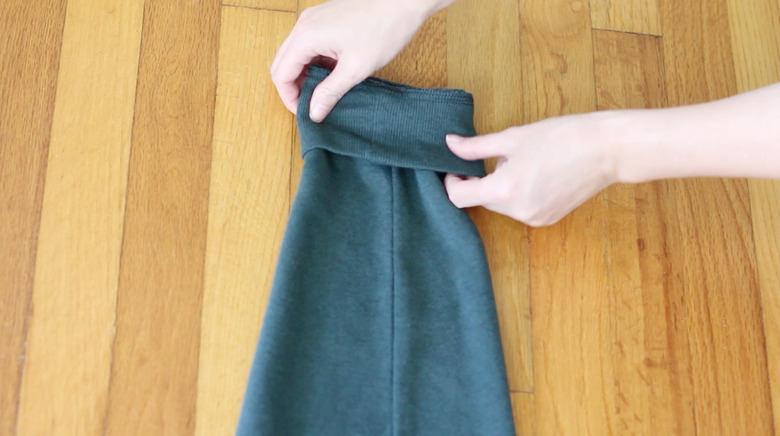 Rolling sleeve cuff down