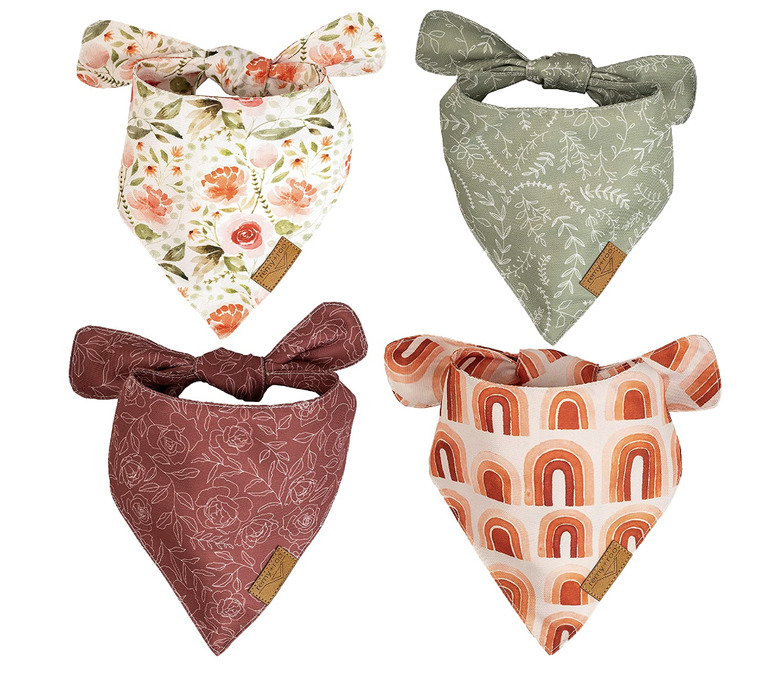 Four dog bandanas with nature motifs like flowers