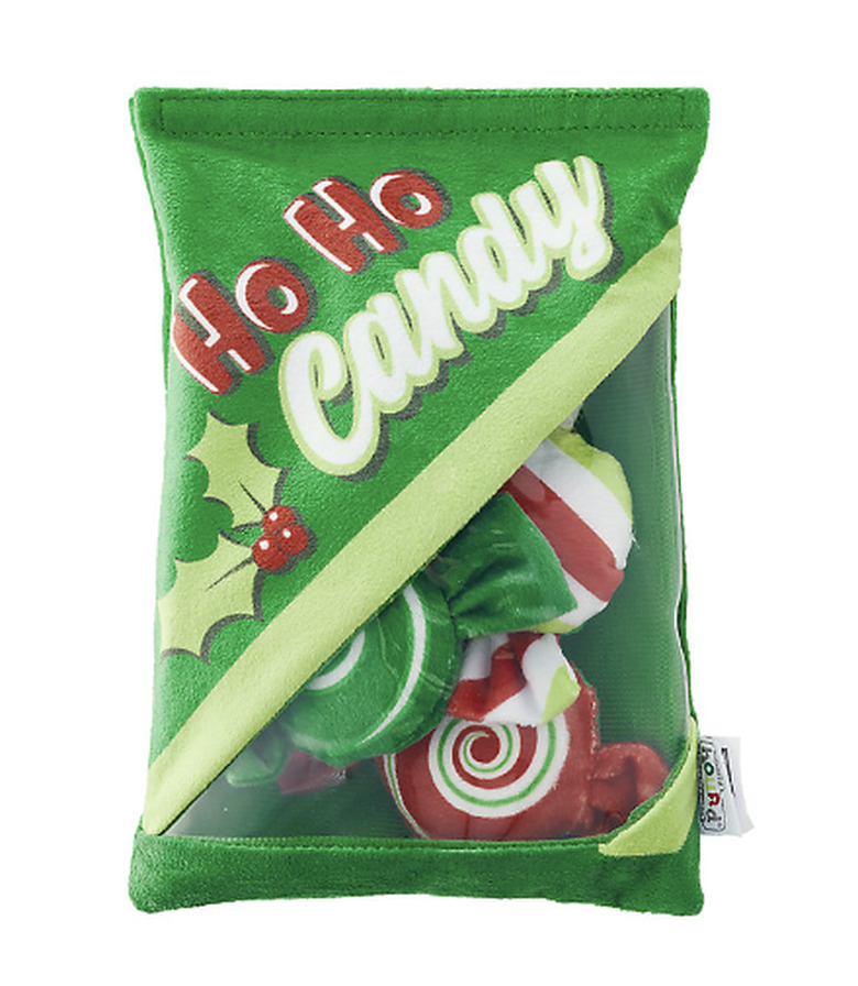 Plush dog toy shaped like a green bag of Ho Ho Candy with removeable candy-shaped toys inside.