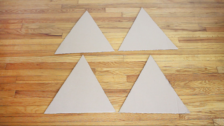 Four cardboard triangles cut out