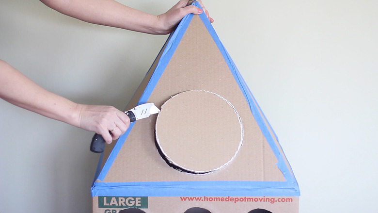 Cutting out round window on top of box