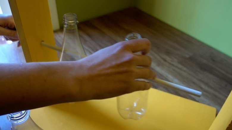 Assembling DIY dog puzzle feeder.