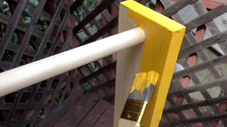 Painting DIY dog puzzle feeder.