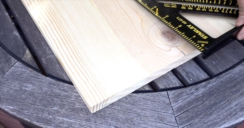 Measuring midpoint on base for DIY dog puzzle feeder.