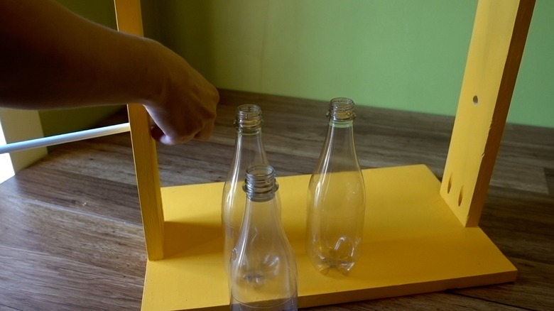 Assembling DIY dog puzzle feeder.