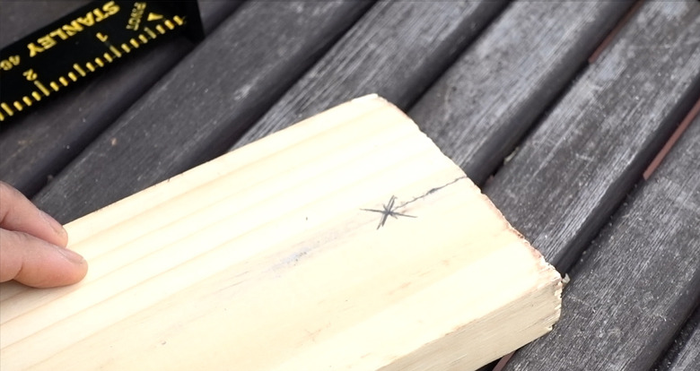 Marking planks for DIY dog puzzle feeder.