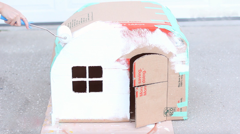 rolling paint onto camper