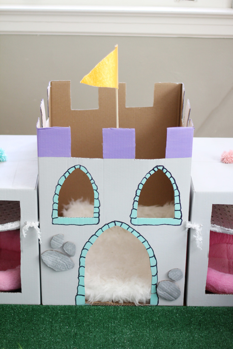 Cardboard house with flag
