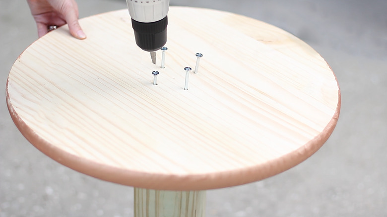 drilling screws into wood circle and post