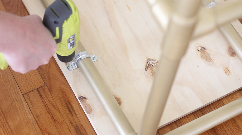 Drilling screws into pipe straps