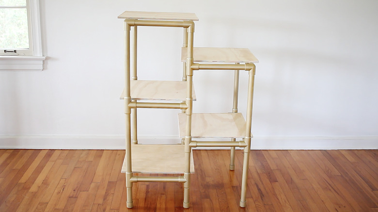 Wood boards placed on each level of cat tree