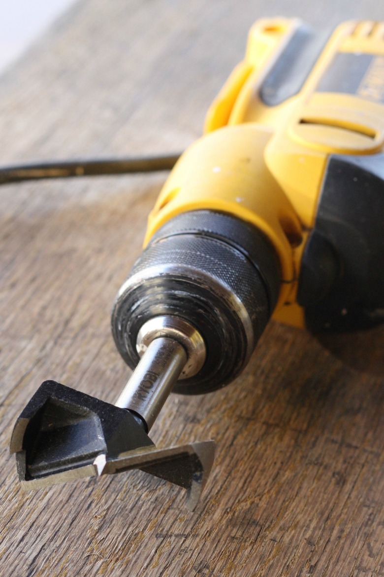 Drill with hole cutting bit