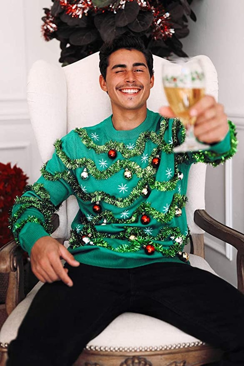 Man wearing green sweater with green tinsel