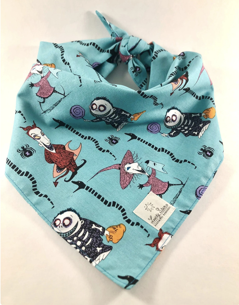 Teal blue pet bandana with the trick-or-treaters from Nightmare Before Christmas on it and a LuckyStarBandanas logo.