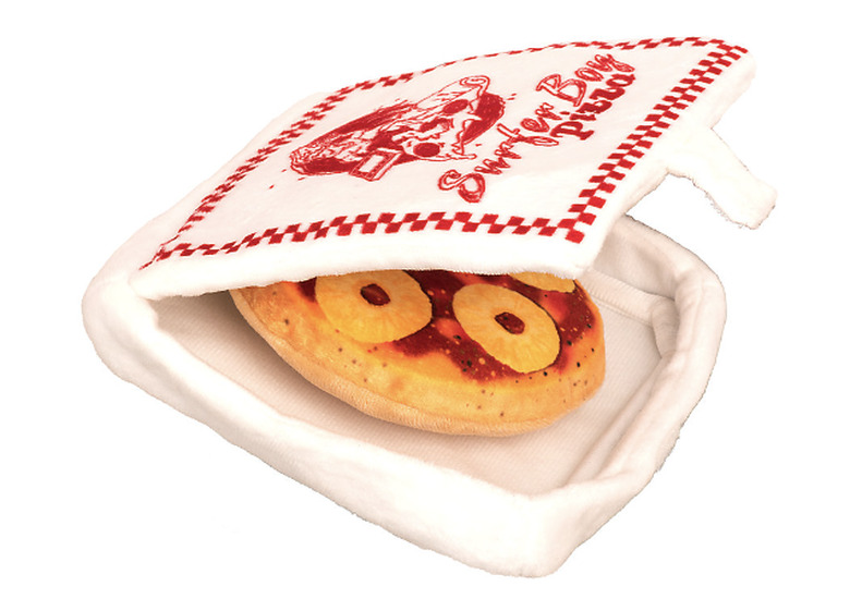 Stranger Things pizza toy. The box has the Surfer Boy Pizza logo on it and the pizza inside is topped with pineapple rings.
