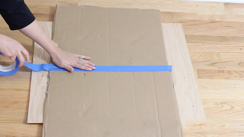 taping two box walls together to form roof