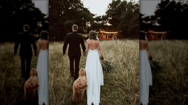 dog trailing bride and groom.