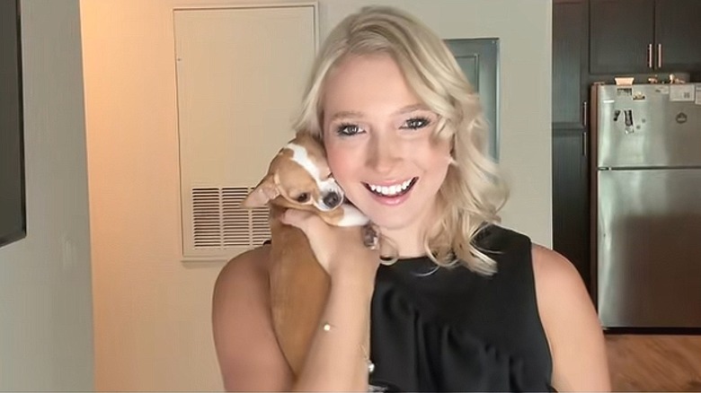 A woman holding her 3-year-old Chihuahua named Blondie