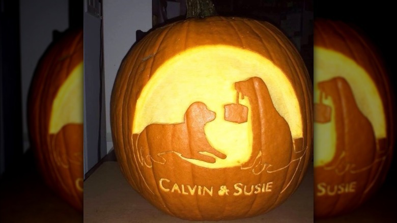dogs carved into pumpkin