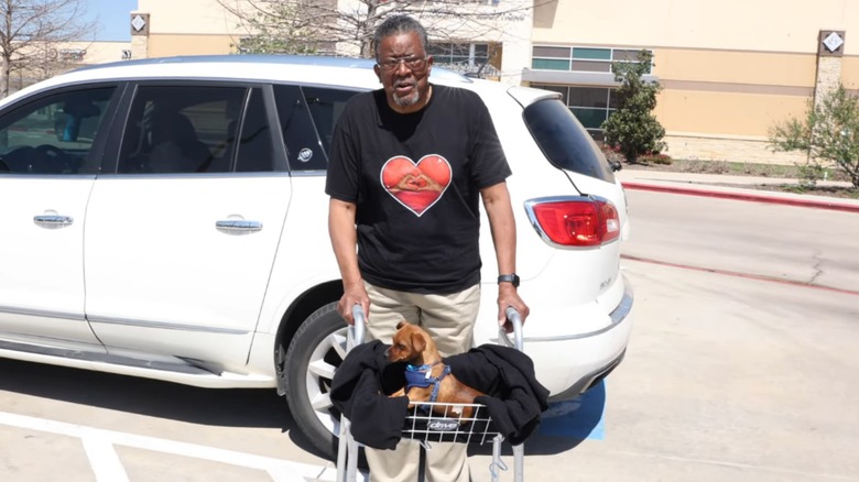 Grandpa recovering from knee surgery with puppy Roscoe nearby