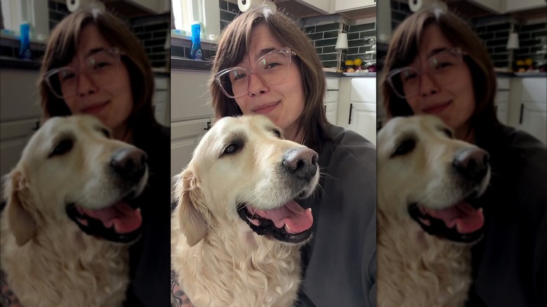 Woman with happy-looking golden retriever